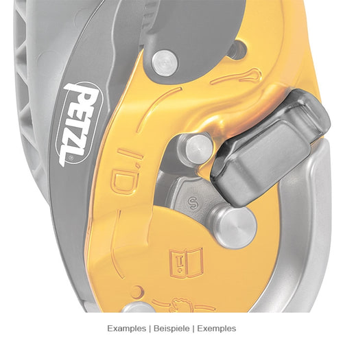 Gros plan sur l’élément de frein Petzl I’D, monté sur un dispositif jaune et gris avec un logo Petzl visible.