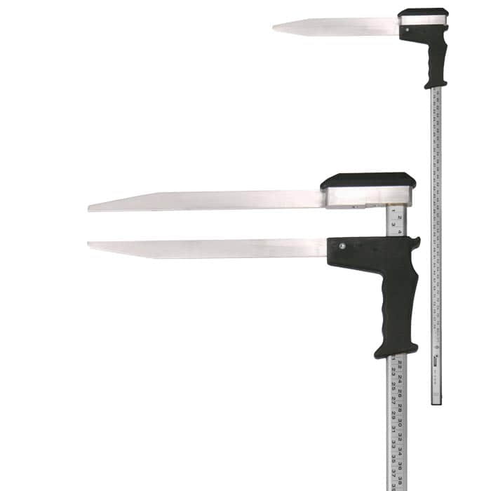 Appareil de mesure Woodruff avec poignée noire et deux longues lames métalliques plates, une règle avec indication centimétrique est fixée