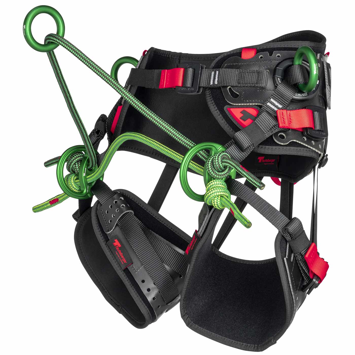 Vue latérale du harnais d’accrobranche treeMOTION Essential X de Teufelberger avec des éléments noirs et rouges et des anneaux métalliques verts