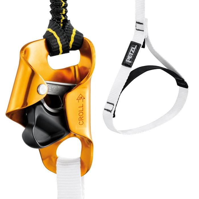 Gros plan sur l’appareil d’aide à la remontée jaune Croll de Petzl avec ruban noir et blanc