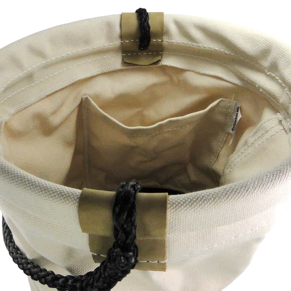 Matériau Seau, vue intérieure du récipient en tissu blanc avec petit compartiment et fermeture à poignée noire