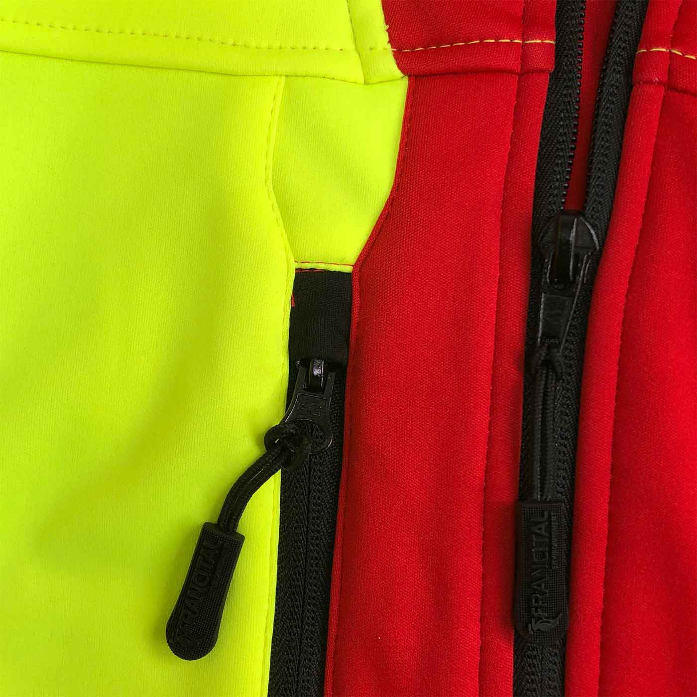 Veste Aigoual R gros plan de fermetures éclair noires et tissu rouge et jaune