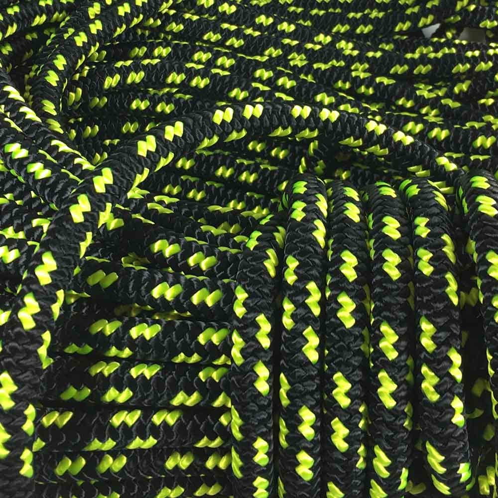 Corde XP-e Bahamas en noir et jaune fluo, tressée, enroulée et posée de manière lâche, vue générale