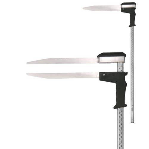 Appareil de mesure Woodruff avec poignée noire et deux longues lames métalliques plates, une règle avec indication centimétrique est fixée