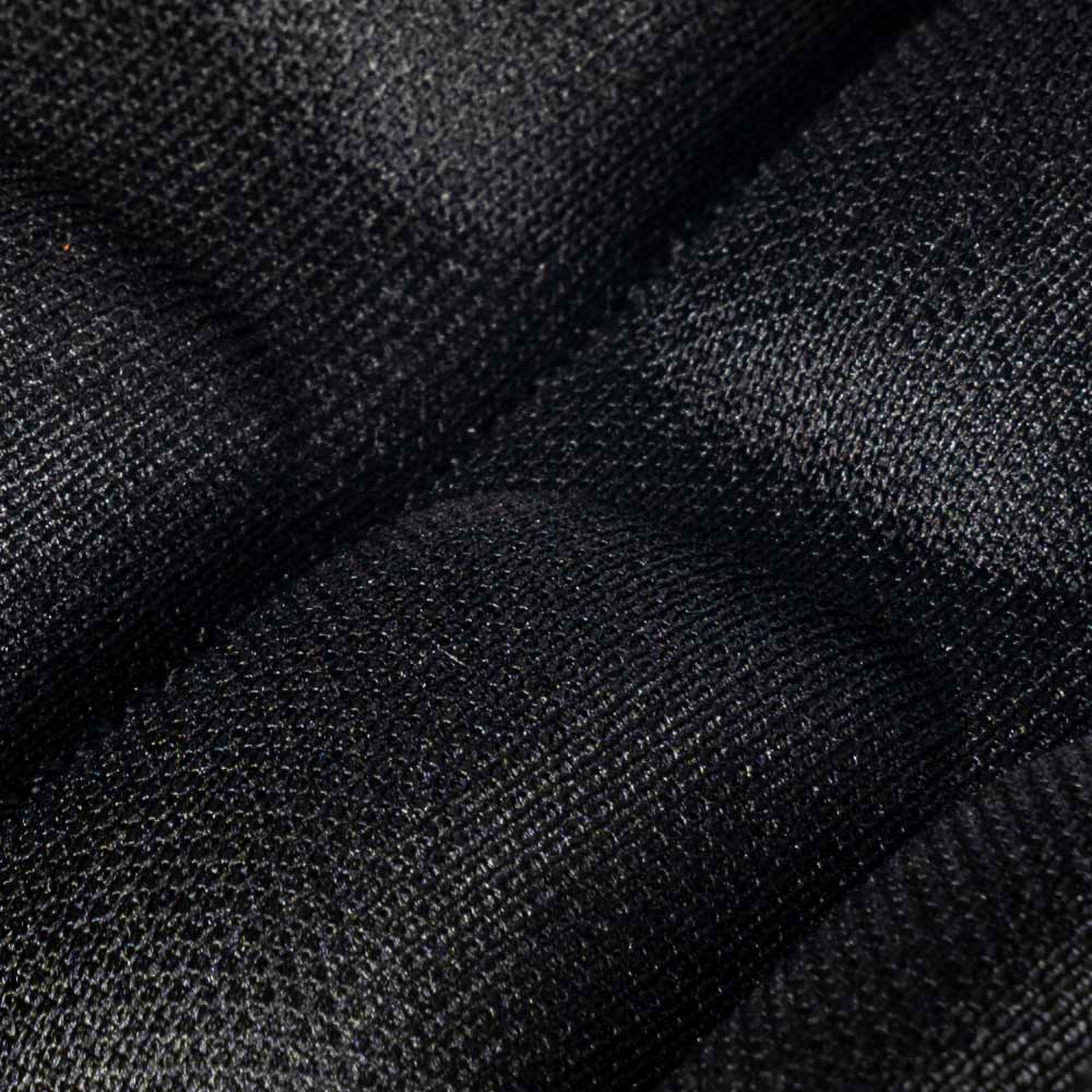 Gros plan d’une fermeture velcro texturée noire avec textile rembourré