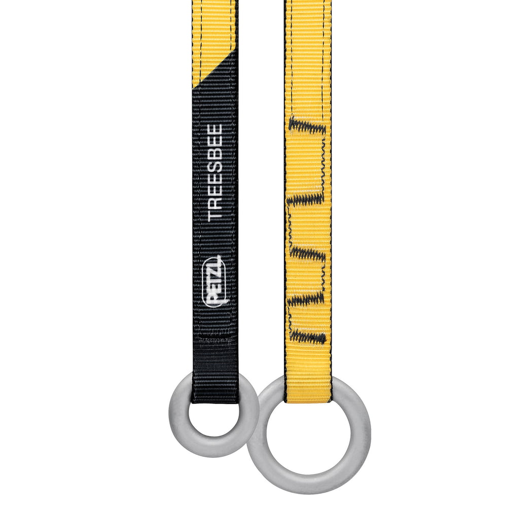 Treesbee - Offrande Petzl, gros plan sur des rubans jaunes et noirs avec des anneaux gris et un logo Petzl blanc sur ruban noir
