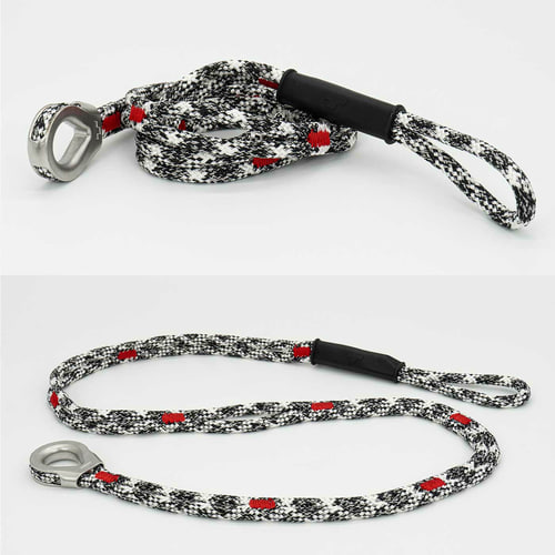 canopyANCHOR Dé à coudre en corde noire, blanche et rouge avec œillet et boucle en métal, posé sur un fond blanc