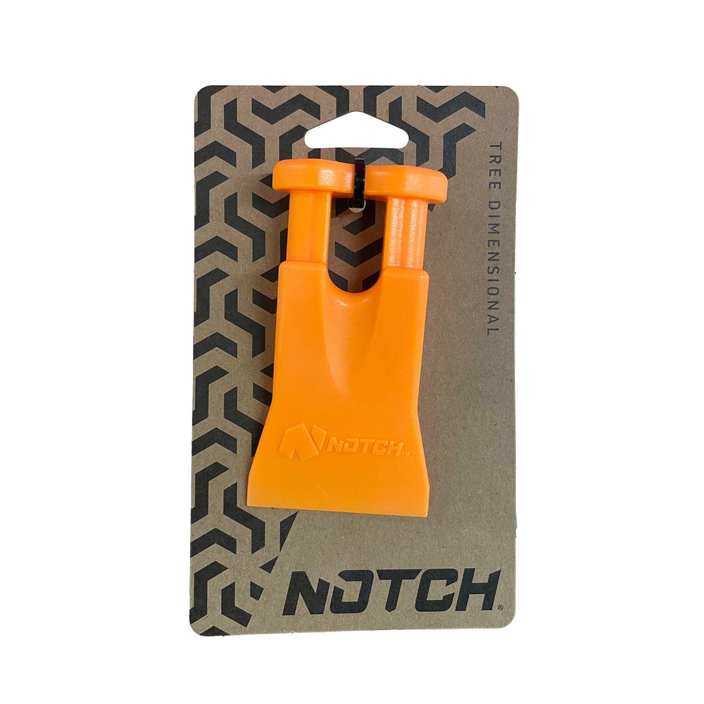 Climbers Best Friend Wedge of Notch, cale en plastique orange attachée à du carton marron avec logo à encoche noire et motif géométrique