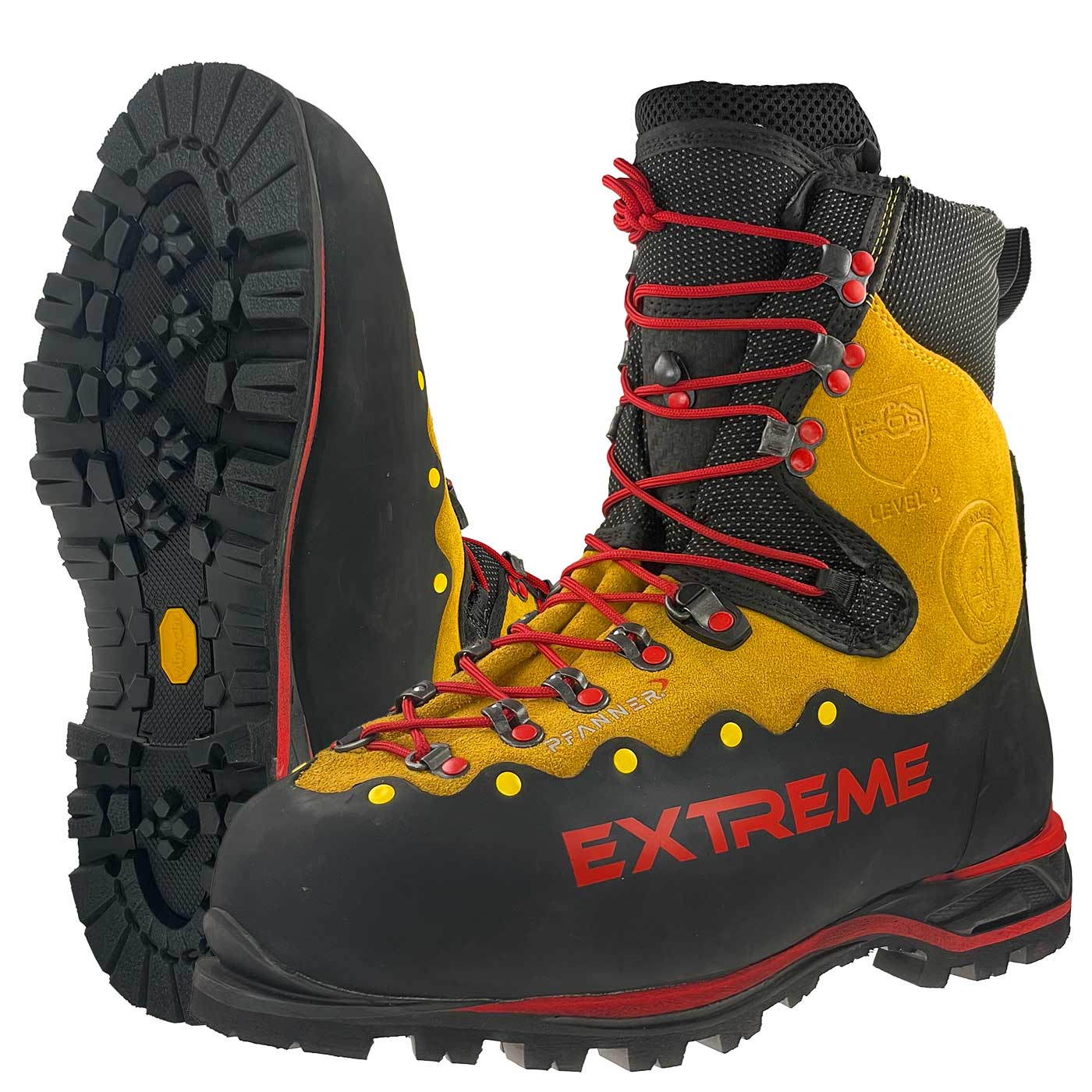 Chaussures de montagne Zugspitze Extreme en jaune et noir avec lacets rouges, semelle crantée et inscription « EXTREME » rouge sur le côté