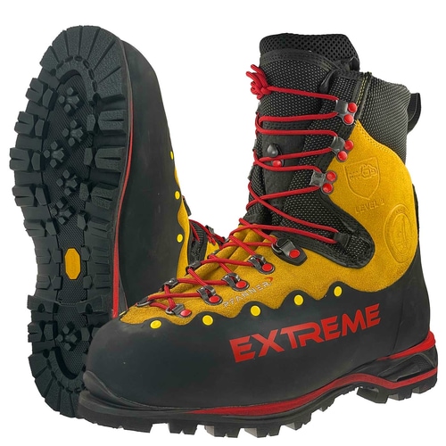 Chaussures de montagne Zugspitze Extreme en jaune et noir avec lacets rouges, semelle crantée et inscription « EXTREME » rouge sur le côté