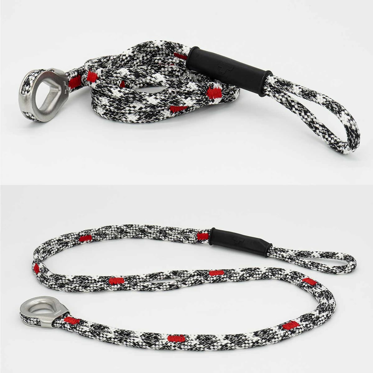 canopyANCHOR Dé à coudre en corde noire, blanche et rouge avec œillet et boucle en métal, posé sur un fond blanc