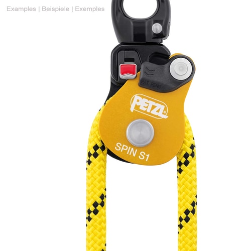 Petzl Spin S1, poulie jaune-noir avec anneau métallique sur le dessus et corde jaune tirée à travers, bouton rouge visible sur la partie noire