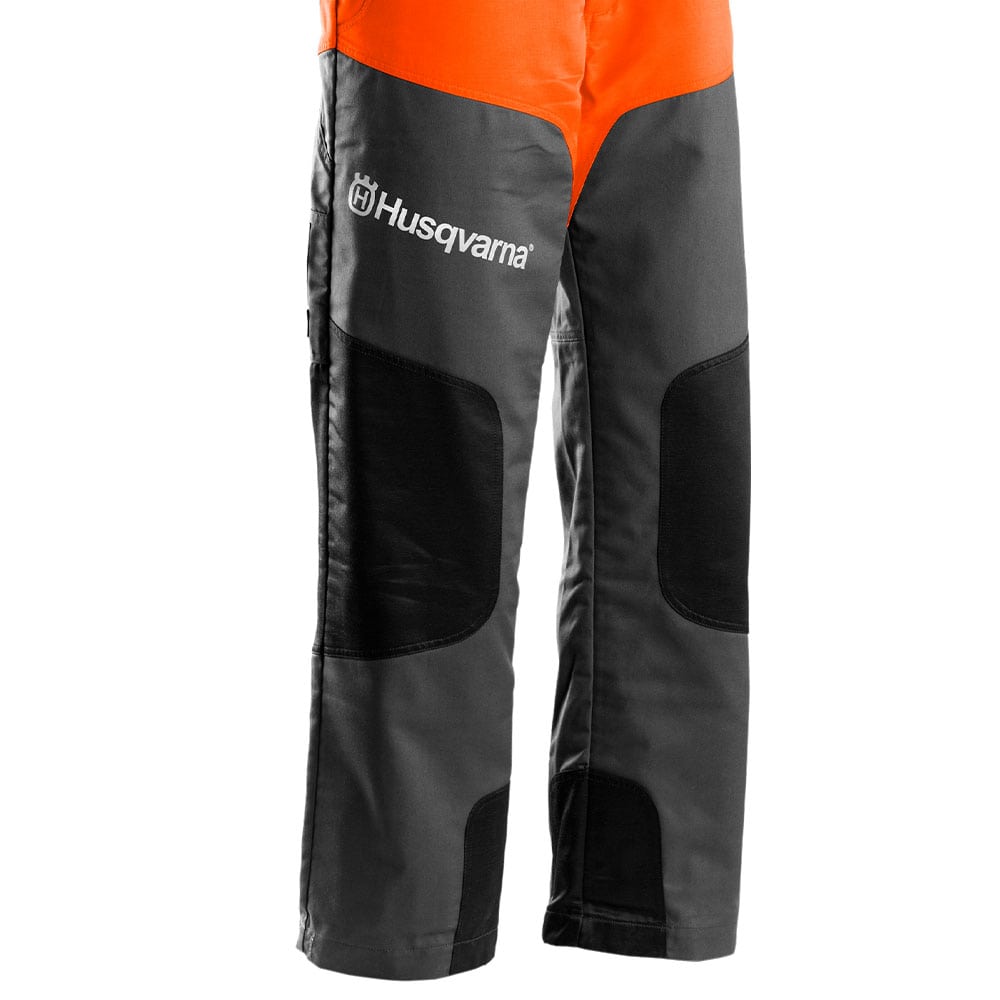 Salopette classique Détail des jambes grises avec genouillères noires et logo Husqvarna blanc